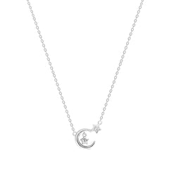 Silver necklace with a moon and star pendant on a white background