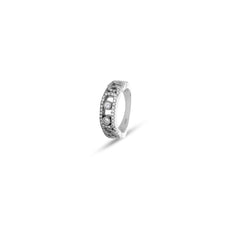 Silver ring with small stones on a white background
