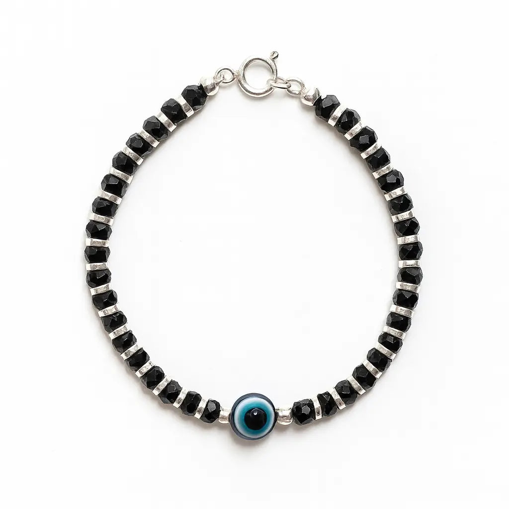 Black beaded bracelet with a blue evil eye charm on a white background