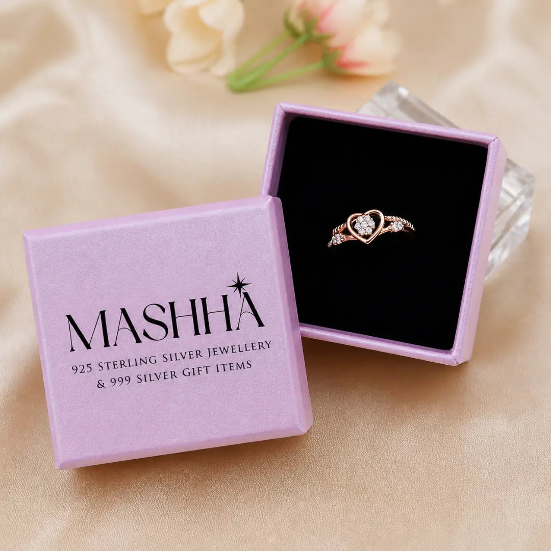Rose gold ring in a MASHHA jewelry box on a beige fabric background