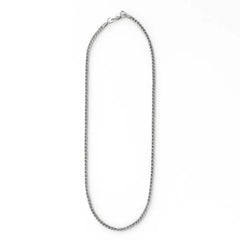 Silver chain necklace on a white background