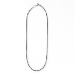 Silver chain necklace on a white background