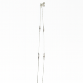 Silver beaded necklace on a white background