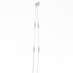 Silver beaded necklace on a white background