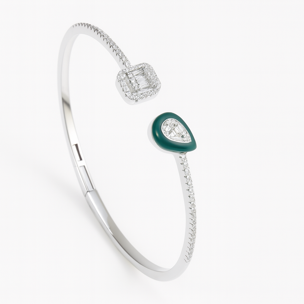 Silver bracelet with green gemstone on a white background