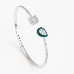 Silver bracelet with green gemstone on a white background