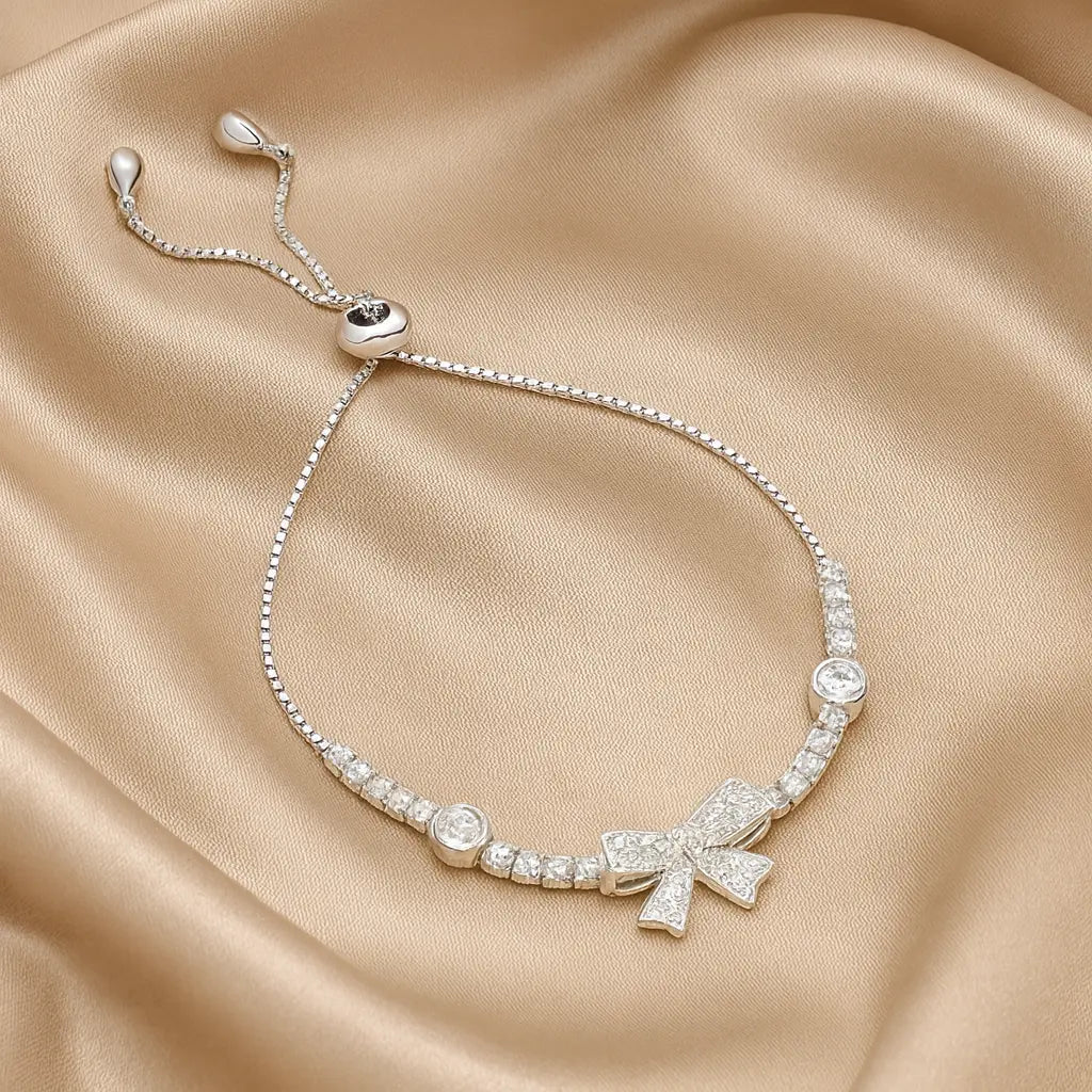 Silver Bow Charm Bracelet with Ruby Accents Mashha