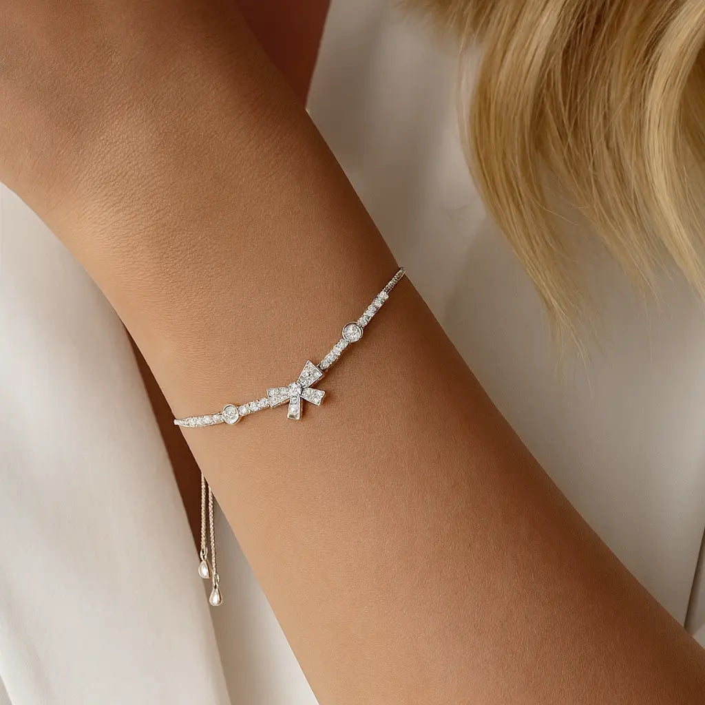 Silver Bow Charm Bracelet with Ruby Accents Mashha