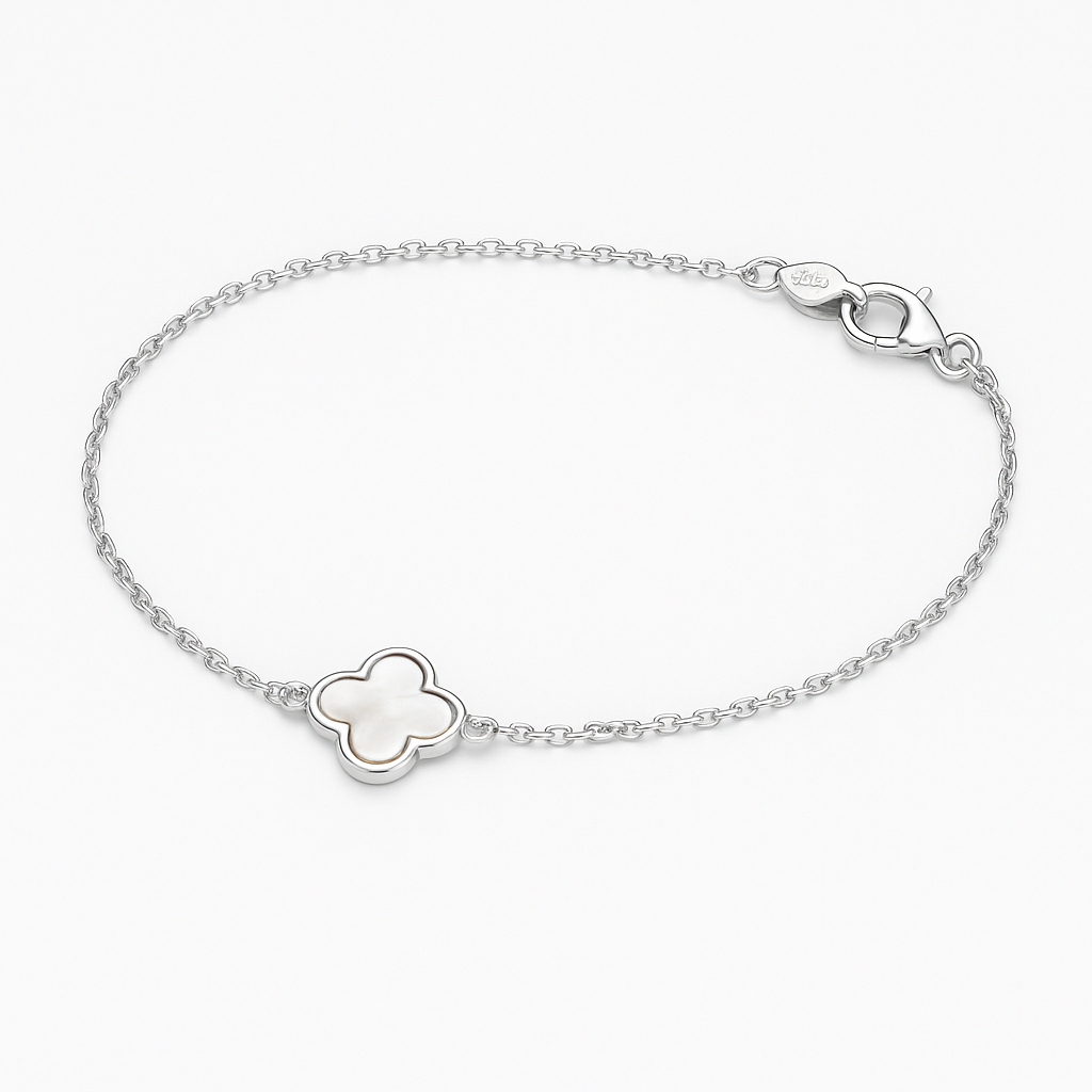 Silver bracelet with a clover-shaped charm on a white background