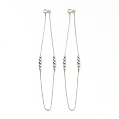 Silver beaded necklace on a white background