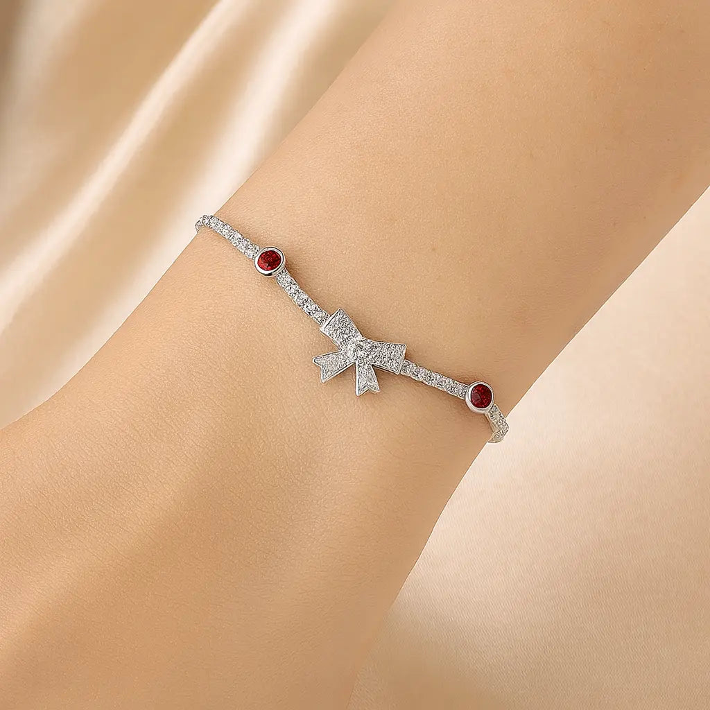 Silver Bow Charm Bracelet with Ruby Accents Mashha