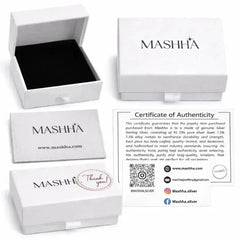 Mashha jewelry packaging with branded box, card, and certificate of authenticity on a white background.