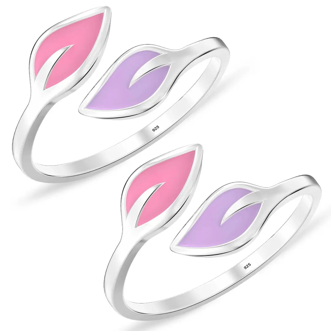 Two silver leaf-shaped rings with pink and purple enamel on a white background