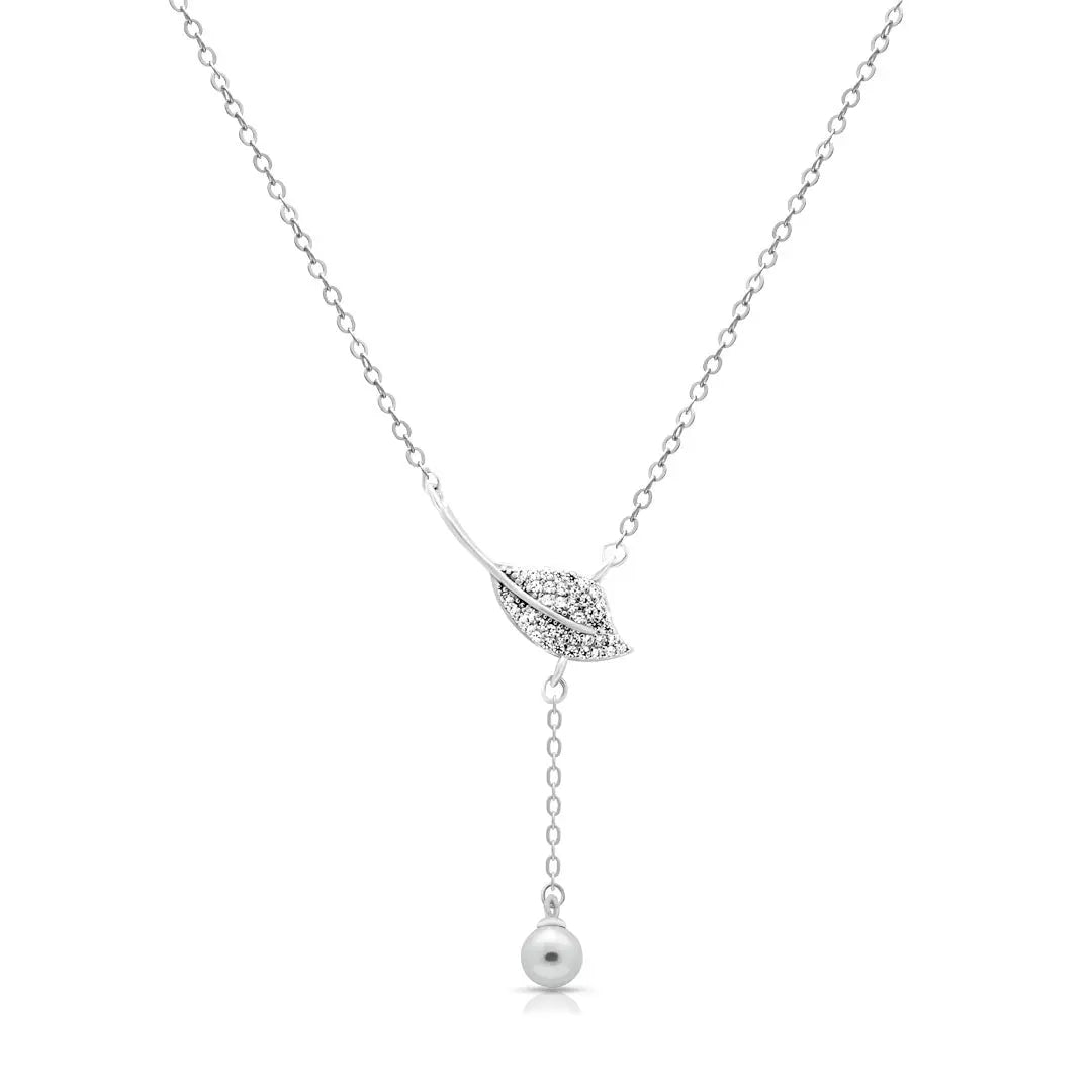 Silver necklace with a leaf pendant and pearl drop on a white background