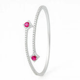 Silver bracelet with pink gemstones on a white background