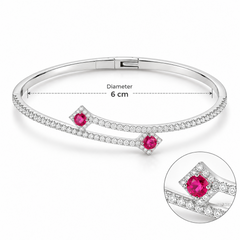 Silver bracelet with pink gemstones on a white background