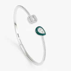 Silver bracelet with green gemstone on a white background