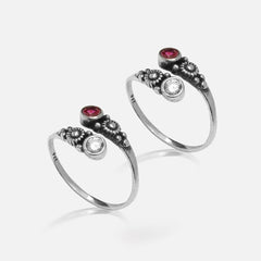 Two silver rings with gemstones on a white background