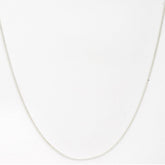 Silver chain necklace on a white background