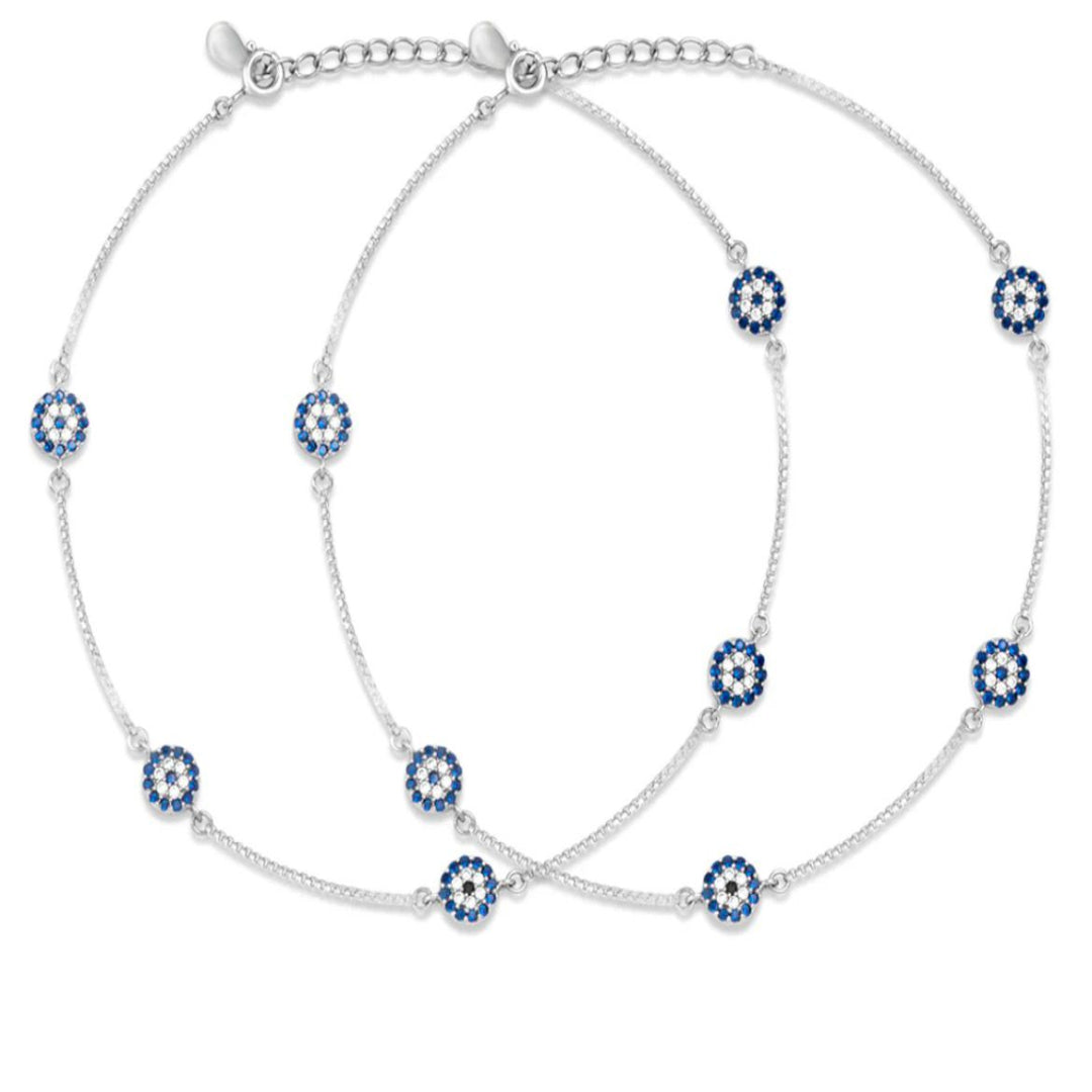 Silver anklet with blue and white floral beads on a white background