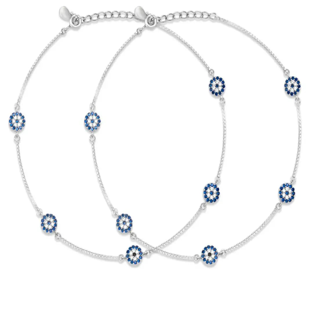 Silver anklet with blue and white floral beads on a white background