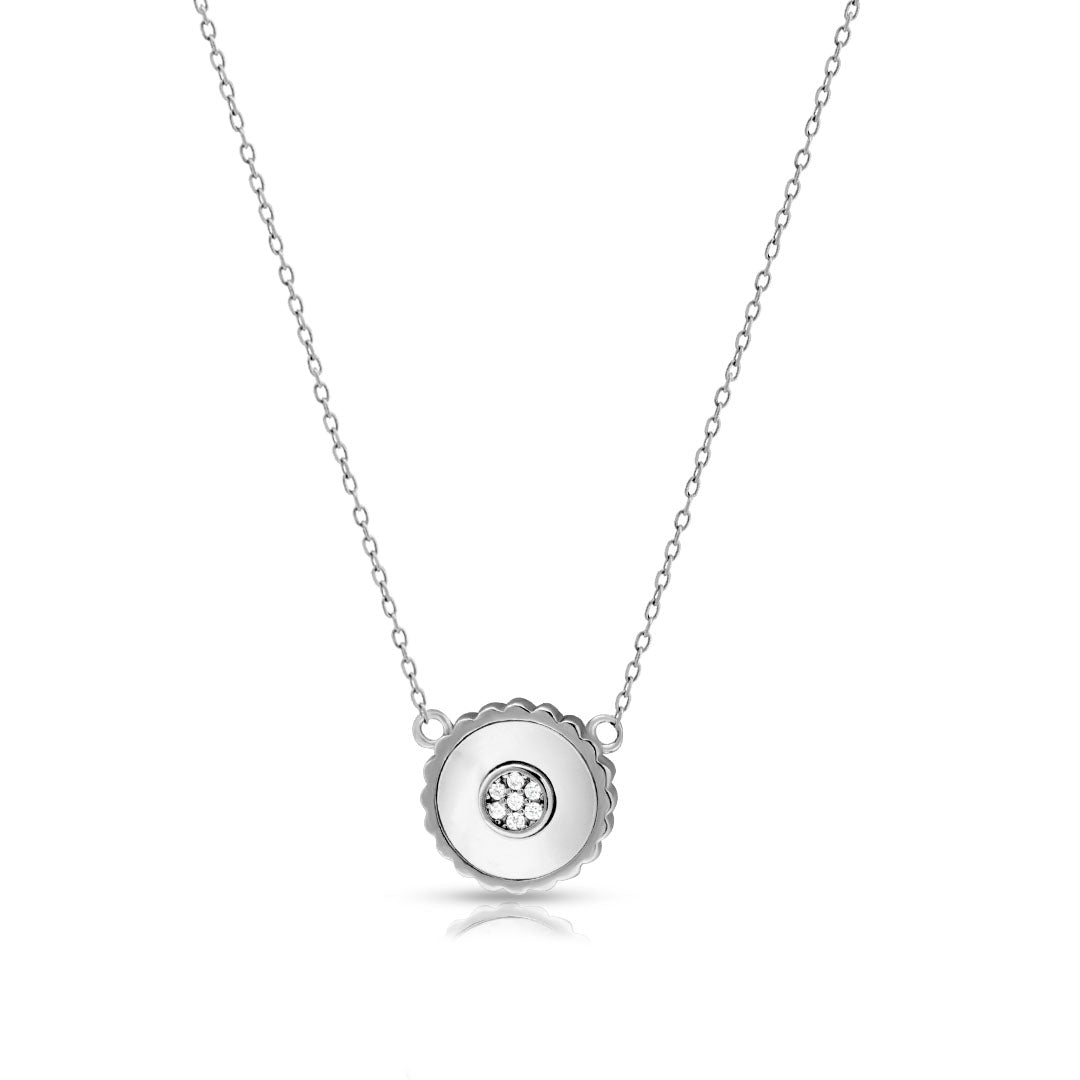 Silver necklace with a round pendant on a white background
