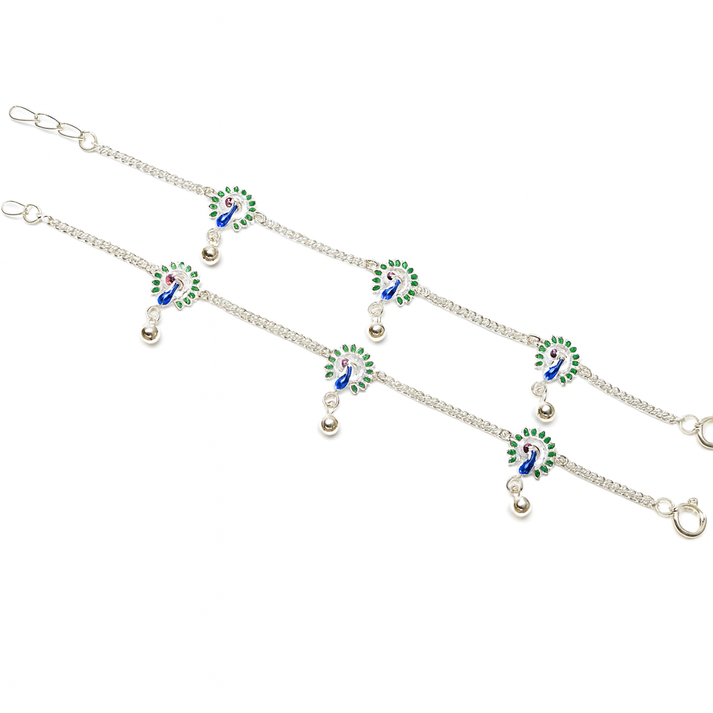 Silver anklet with green and blue peacock designs on a white background