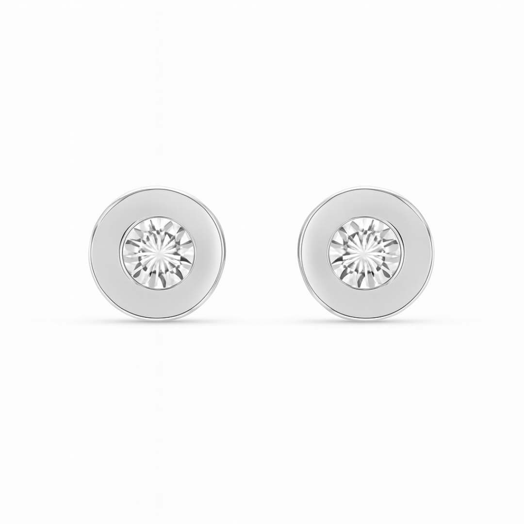 Pair of silver round earrings with clear gemstones on a white background