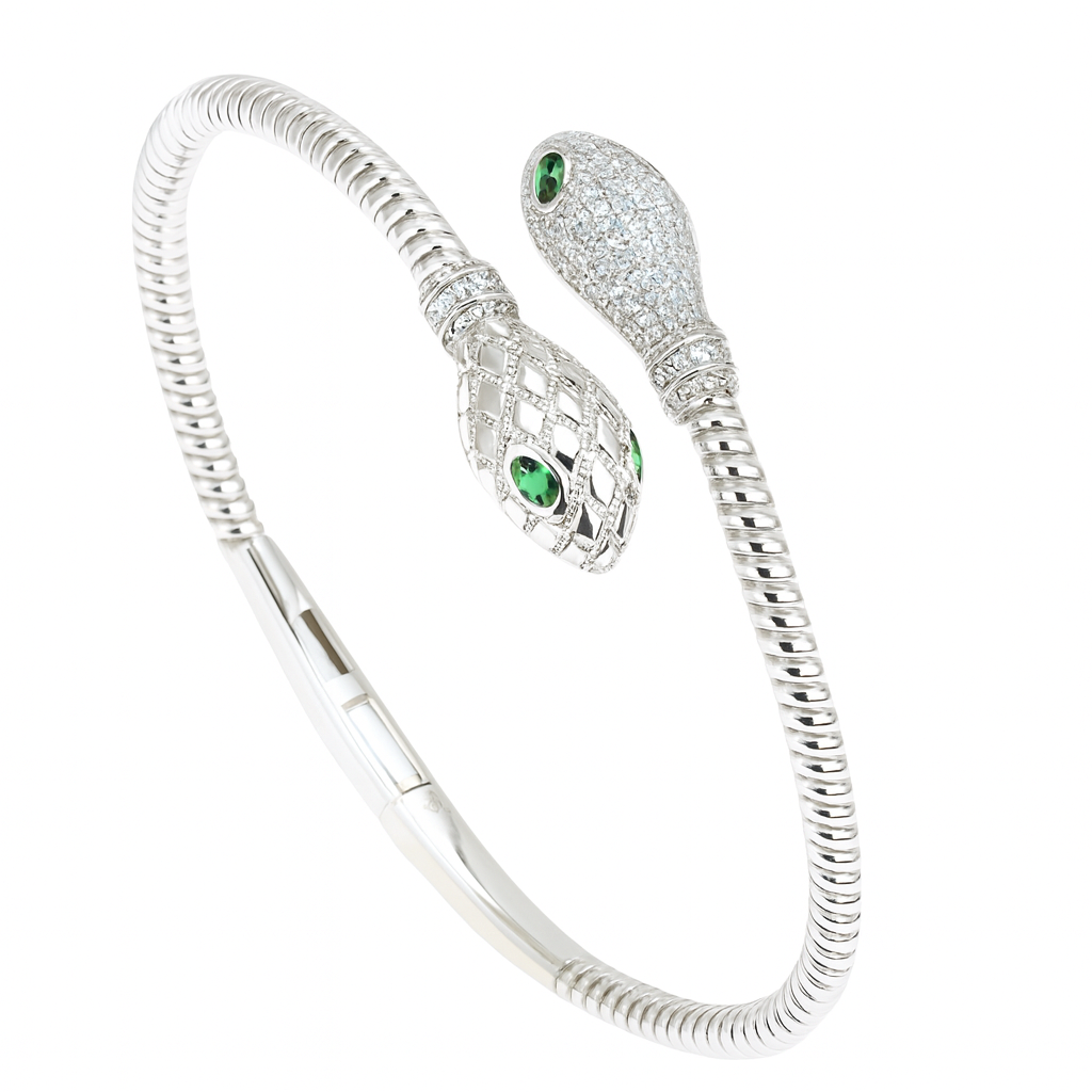 Silver snake bracelet with green eyes on a white background