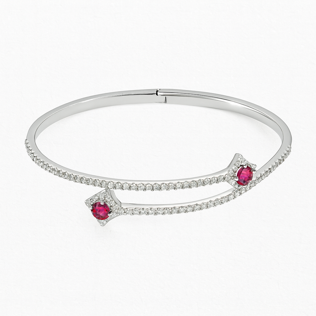 Silver bracelet with red gemstones on a white background