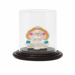 Statue of a deity in a glass dome on a white background