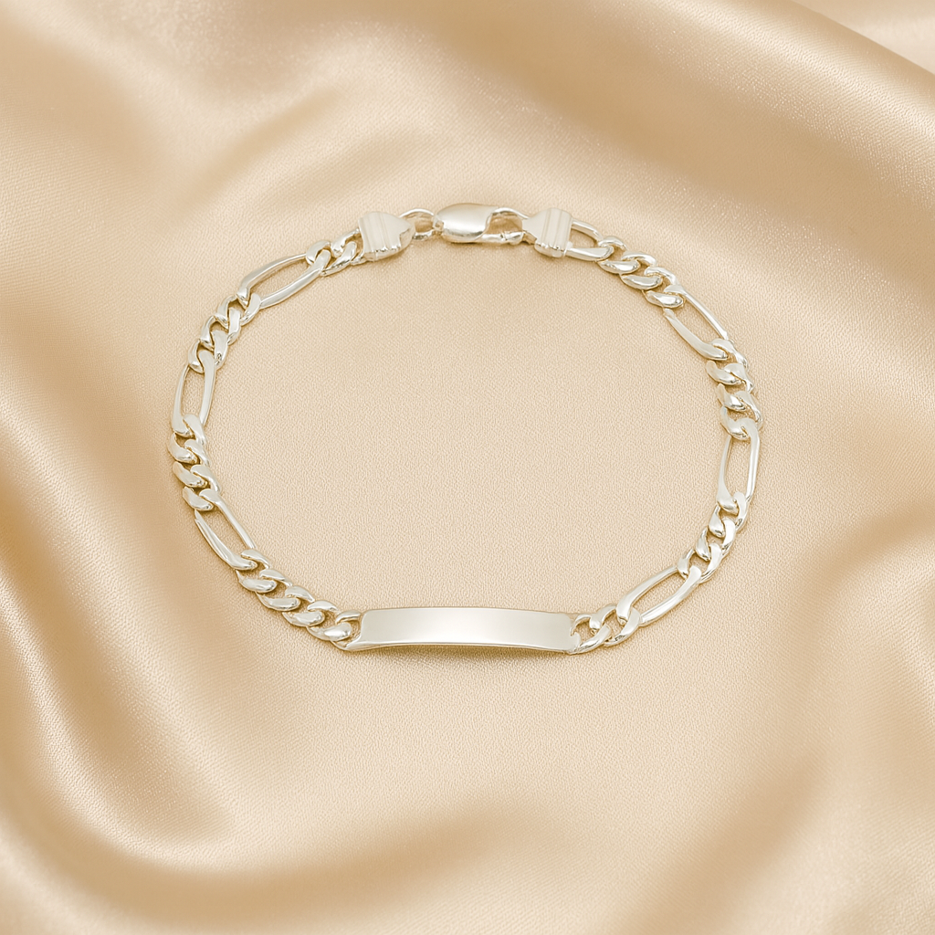 Gold chain bracelet on a satin surface