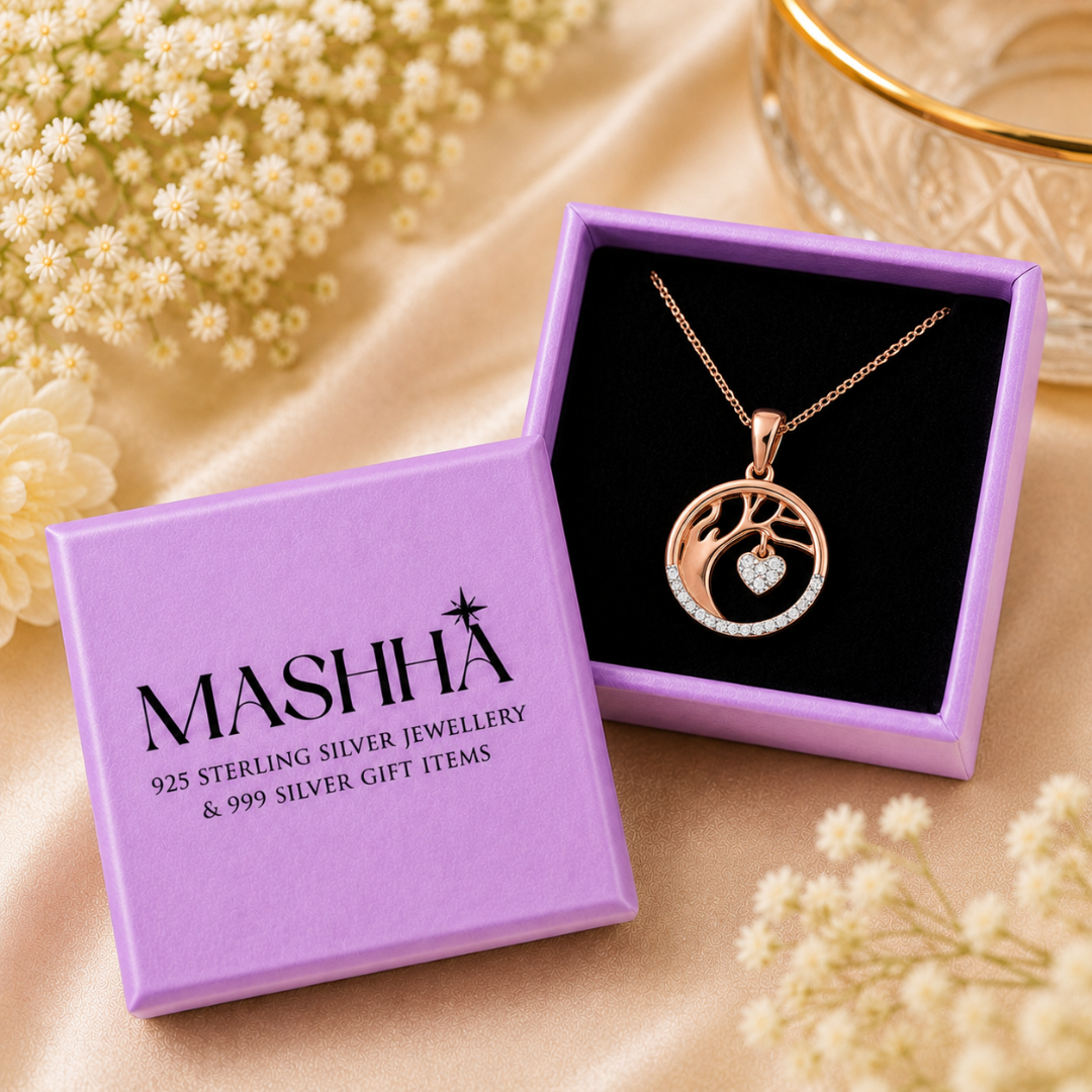Rose gold necklace with heart pendant in a MASHHA jewelry box on a beige surface with flowers.