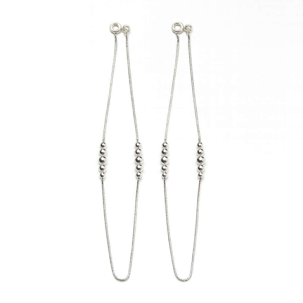 Silver beaded necklace on a white background