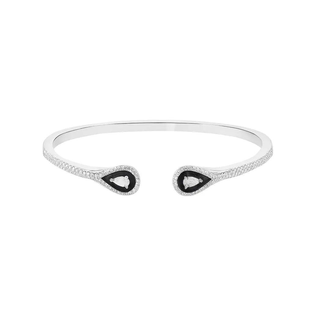 Silver bracelet with black and white gemstones on a white background
