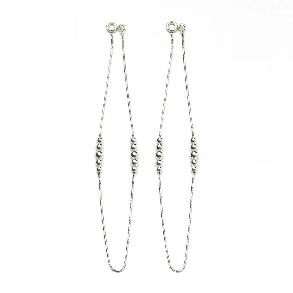 Silver beaded necklace on a white background