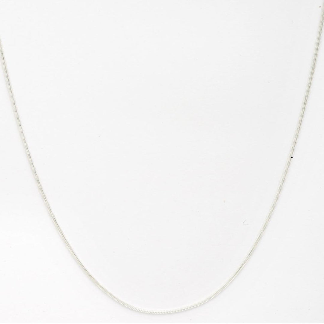 Silver chain necklace on a white background