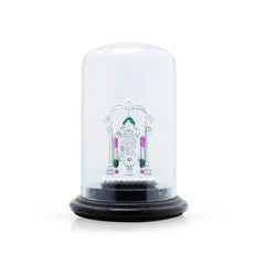 Decorative item with a clear dome and black base on a white background