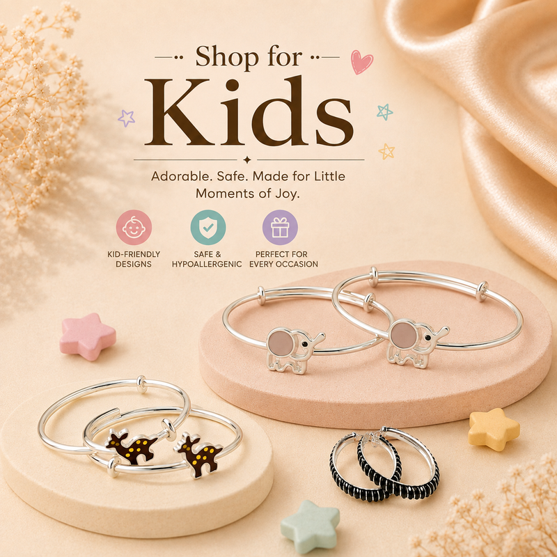 A styled product display for kids' jewelry on beige pedestals with decorative props. 