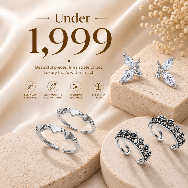 The set includes two butterfly-shaped stud earrings and two open cuff rings